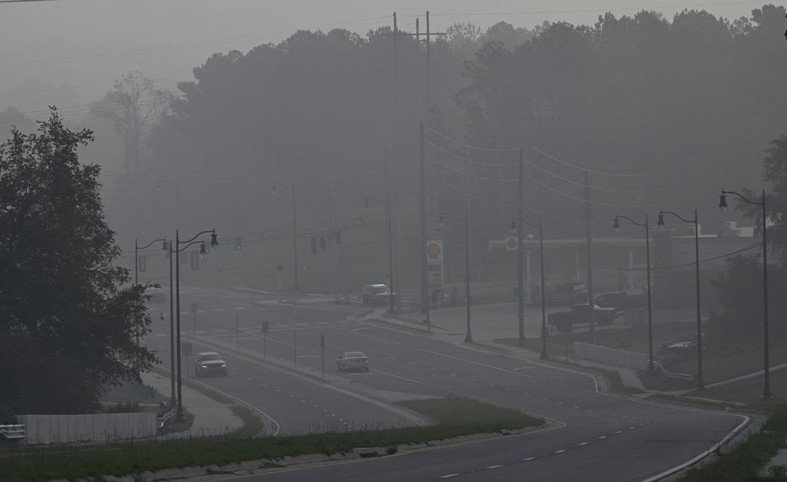 A chemical haze envelops part of Conyers, Georgia, the day after a BioLab plant fire spewed chlorine and smoke into the air.