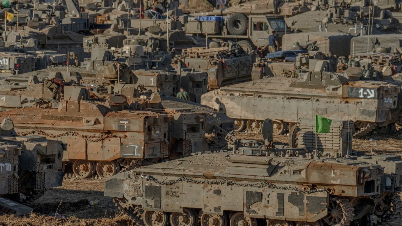  Israeli tanks and APC’s are seen gathering by the Lebanese border on Monday.