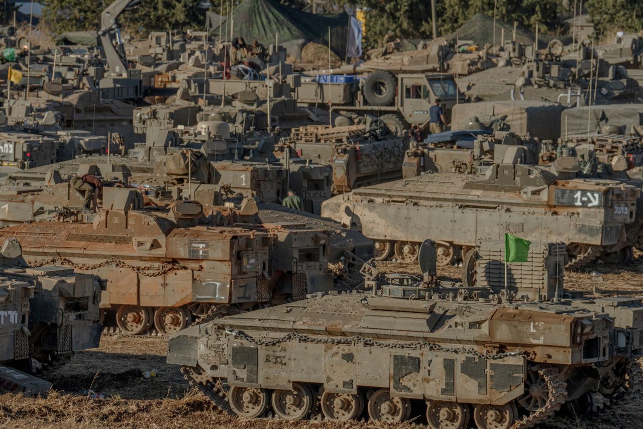  Israeli tanks and APC’s are seen gathering by the Lebanese border on Monday.