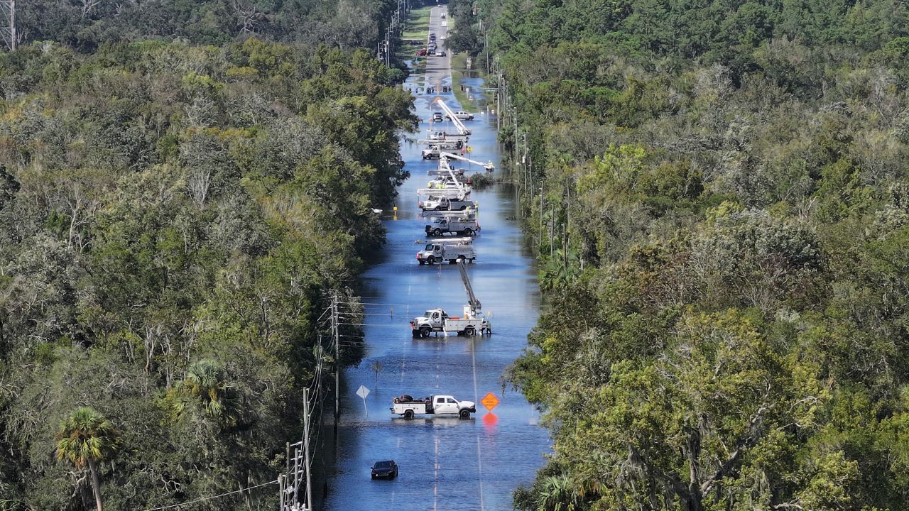 People work on power lines after Hurricane Helene passed offshore in Crystal River, Florida, on September 27.