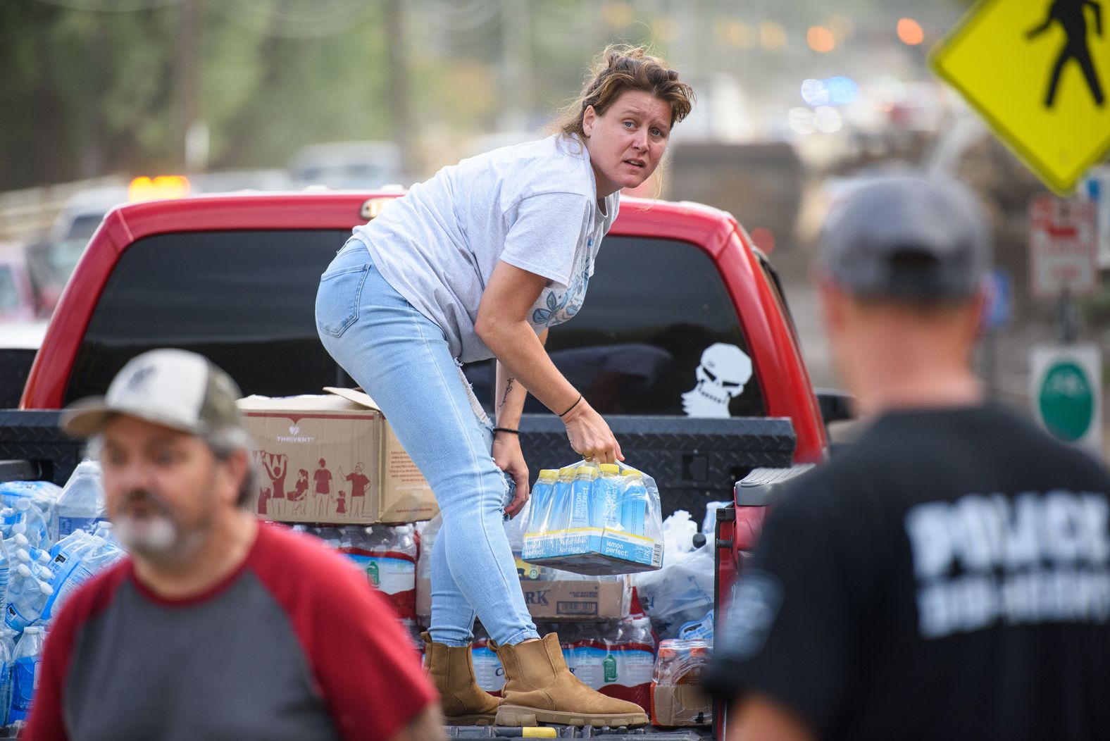 Ashley Dillinger donates water at the Town Hall in Old Fort, North Carolina, on Monday.