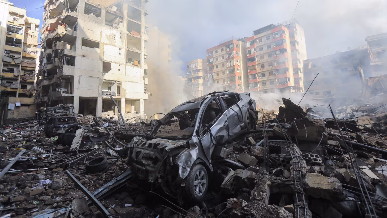 TOPSHOT - Smoke seeps out from building rubble at the site of an overnight Israeli airstrike on the Laylaki neighbourhood in Beirut's southern suburbs on October 1, 2024. (Photo by AFP) (Photo by -/AFP via Getty Images)