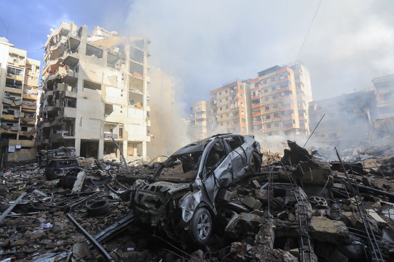 TOPSHOT - Smoke seeps out from building rubble at the site of an overnight Israeli airstrike on the Laylaki neighbourhood in Beirut's southern suburbs on October 1, 2024. (Photo by AFP) (Photo by -/AFP via Getty Images)