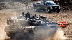 An Israeli army main battle tank moves at a position along the border with Lebanon in northern Israel on October 1, 2024. The Israeli army on October 1 said it launched a ground offensive in Lebanon and that its forces engaged in clashes, further escalating the conflict after a week of intense air strikes that killed hundreds. The UN peacekeeping mission in Lebanon said, however, the Israeli operation did not amount to a "ground incursion" and while Hezbollah denied any troops had crossed the border, an Israeli security official said localised raids had taken place and they were limited in scope. (Photo by Ahmad GHARABLI / AFP) (Photo by AHMAD GHARABLI/AFP via Getty Images)