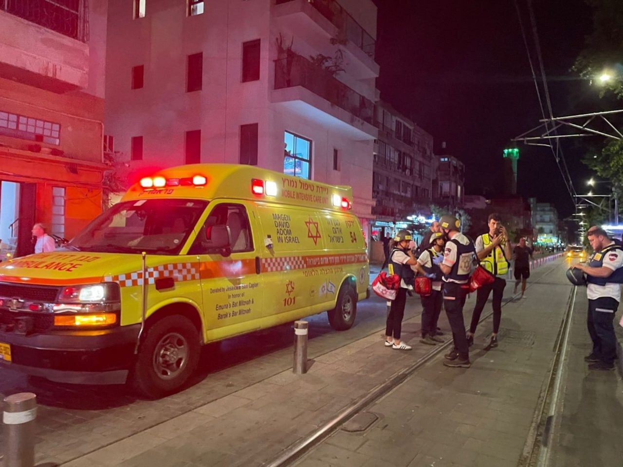 Medics are deployed to the scene after armed attack in Jaffa, Tel Aviv on Monday.