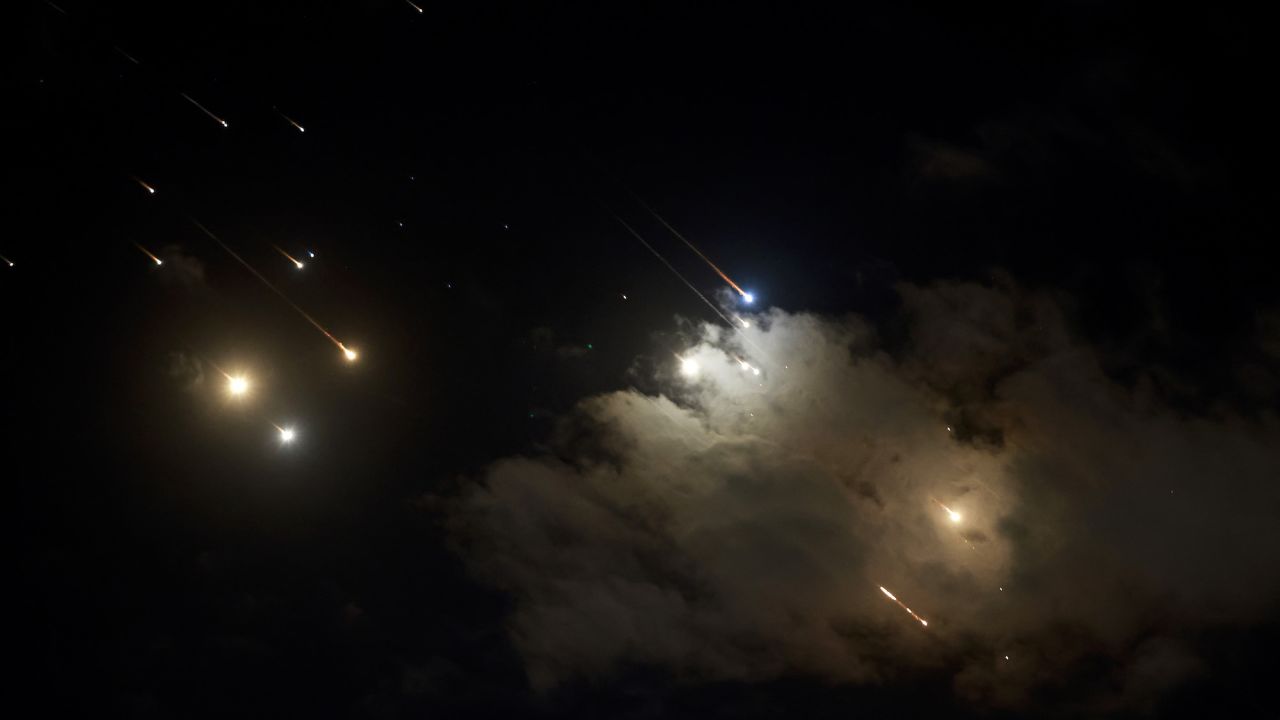 Iranian-launched projectiles are seen being intercepted by Israel above Jerusalem.