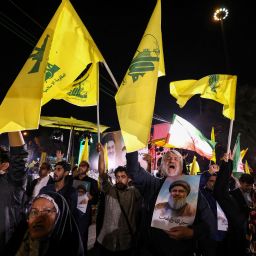 Iranians celebrate at Palestine Square in Tehran following Iran's air attack on Israel, on October 1, 2024. Iran's Revolutionary Guards said a missile attack under way against Israel on October 1 was in response to the killing of Hezbollah chief Hassan Nasrallah last week as well as that of the Hamas leader. (Photo by ATTA KENARE / AFP) (Photo by ATTA KENARE/AFP via Getty Images)