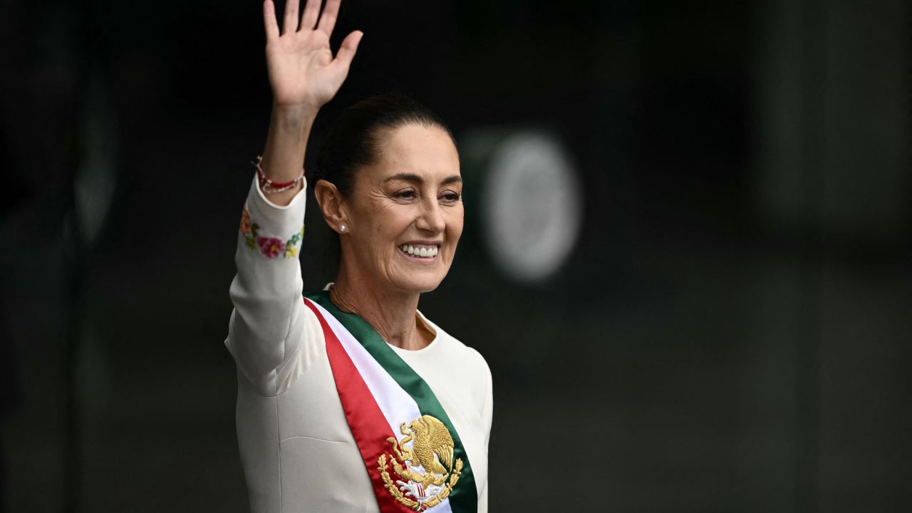 Mexico's President Claudia Sheinbaum waves at the crowd as she leaves the Congress of the Union after her inauguration ceremony in Mexico City on October 1, 2024. (Photo by CARL DE SOUZA / AFP) (Photo by CARL DE SOUZA/AFP via Getty Images)