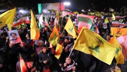 Demonstrators wave flags of Iran and Hezbollah during a rally celebrating after Iran launched a barrage of missiles at Israel in response to the killings of Hezbollah's leader Hassan Nasrallah and other Iran-backed militants outside Imam Jaafar Sadiq Mosque in Tehran's Palestine Square on October 1, 2024. Reports said Iran fired between 150 and 200 missiles in the attack, the country's second on Israel after a missile and drone attack in April in response to a deadly Israeli air strike on the Iranian consulate in Damascus. (Photo by ATTA KENARE / AFP) (Photo by ATTA KENARE/AFP via Getty Images)