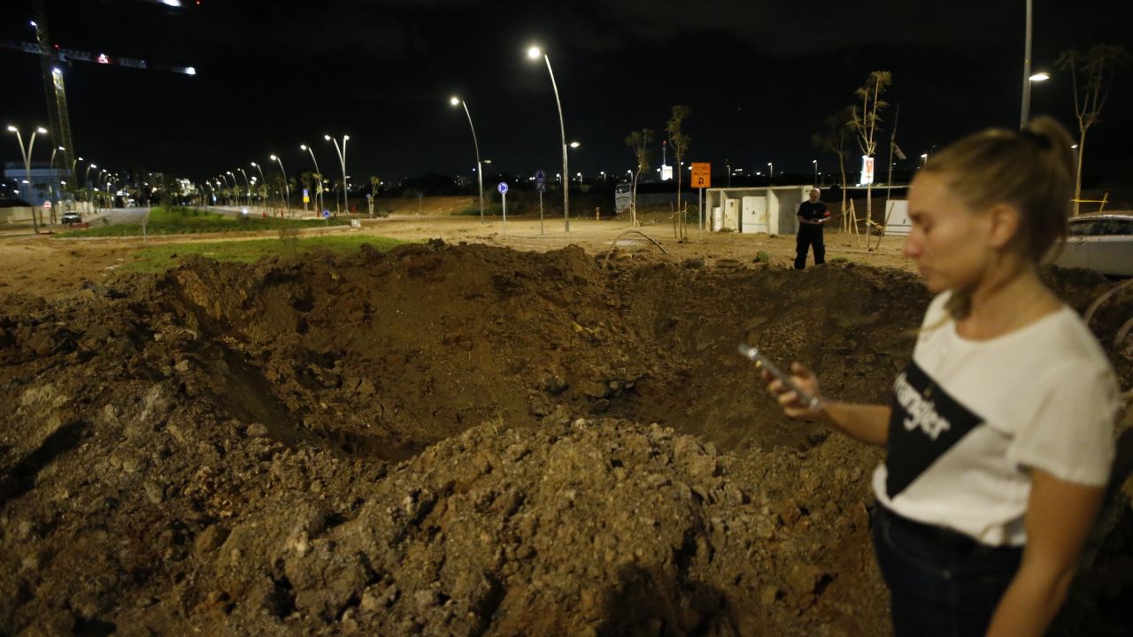 A crater is seen in Herzliya, north of Tel Aviv, on Tuesday.