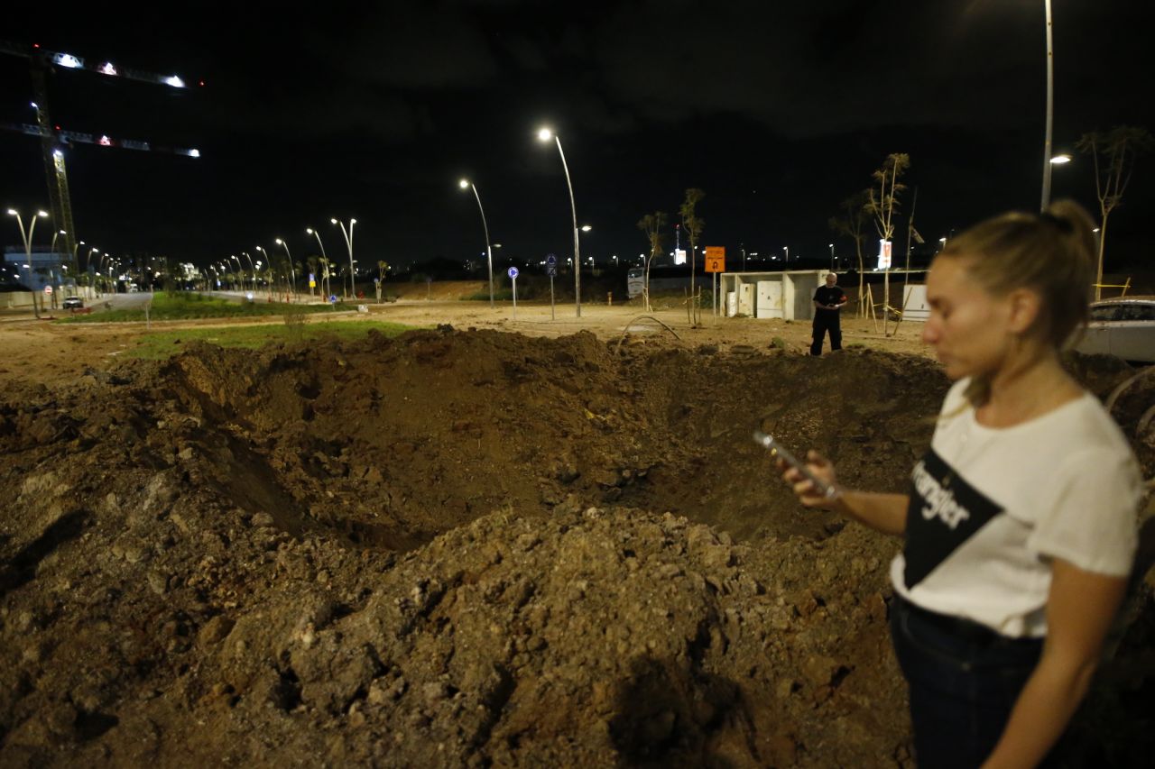 A crater is seen in Herzliya, north of Tel Aviv, on Tuesday.