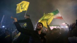 Demonstrators celebrate during a rally outside the British Embassy in Tehran on October 1, 2024, after Iran fired a barrage of missiles into Israel in response to the killing of Hezbollah leader Hassan Nasrallah and other Iranian-backed militias. Reports indicate that Iran fired between 150 and 200 missiles at Tehran. This is the country's second attack on Israel after a missile and drone attack in April in response to a deadly Israeli airstrike on the Iranian consulate in Damascus. (Photo by ATTA KENARE / AFP) (Photo by ATTA KENARE/AFP via Getty Images)