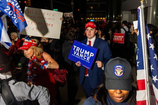 Supporters of the Republican ticket gather outside the debate site on Tuesday.