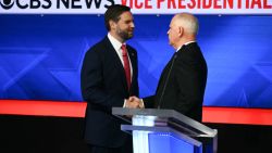 US Senator and Republican vice presidential candidate J.D. Vance (L) and Minnesota Governor and Democratic vice presidential candidate Tim Walz shake hands at the end of the Vice Presidential debate hosted by CBS News at the CBS Broadcast Center in New York City on October 1, 2024. (Photo by ANGELA WEISS / AFP) (Photo by ANGELA WEISS/AFP via Getty Images)