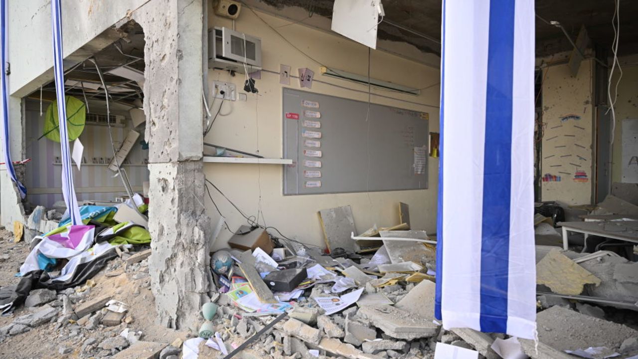 GEDERA, ISRAEL - OCTOBER 2: People survey the damage caused to the Shalhavot Chabad elementary school in Gedera after a missile attack in Gedera, Israel on October 2, 2024. The Israeli military says missiles have been fired from Iran toward Israel, marking a further escalation in the regional conflict. (Photo by Leon Neal/Getty Images)