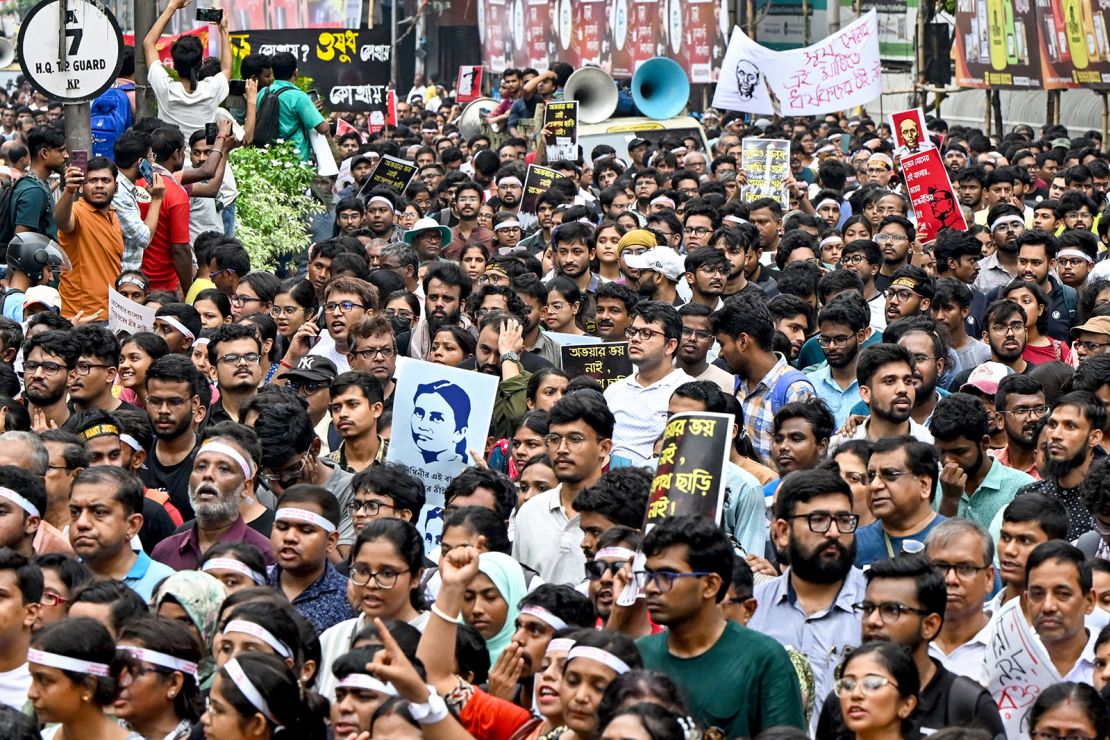 Doctors and social activists carry posters during a rally to condemn the rape and murder of a medic in Kolkata on October 2, 2024.