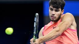 Spain's Carlos Alcaraz hits a return to Italy's Jannik Sinner during their men's singles final match at the China Open tennis tournament in Beijing on October 2, 2024. (Photo by Greg Baker / AFP) (Photo by GREG BAKER/AFP via Getty Images)