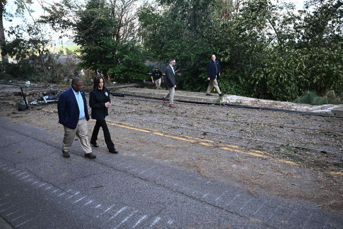 Vice President Kamala Harris walks with Augusta Mayor Garnett Johnson as they survey the damage from Hurricane Helene, in the Meadowbrook neighborhood of Augusta, Georgia, on October 2, 2024.