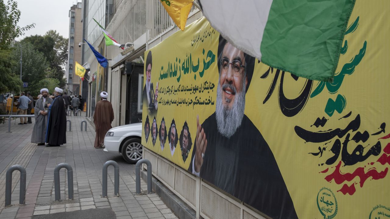 A banner bearing a picture of slain Lebanese Hezbollah leader Hassan Nasrallah hangs in central Tehran, two days after his targeted assassination by Israeli forces in Beirut's southern suburbs, on September 29.