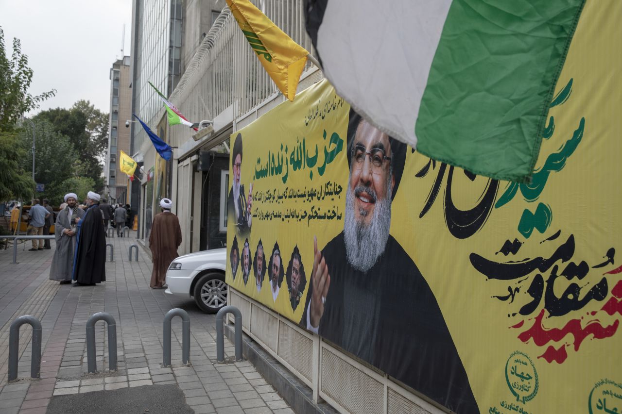 A banner bearing a picture of slain Lebanese Hezbollah leader Hassan Nasrallah hangs in central Tehran, two days after his targeted assassination by Israeli forces in Beirut's southern suburbs, on September 29.