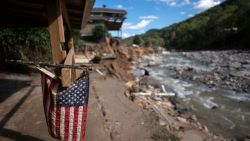 CHIMNEY ROCK, NORTH CAROLINA - OCTOBER 2: A tattered American flag is seen on a property amongst flood damage in the aftermath of Hurricane Helene on October 2, 2024 in Chimney Rock, North Carolina. The death toll has topped 140 people across the southeastern U.S. due to the storm, according to published reports, which made landfall as a category 4 storm on Thursday. Millions are without power and the federal government has declared major disasters in areas of North Carolina, Florida, South Carolina, Tennessee, Georgia, Virginia and Alabama, freeing up federal emergency management money and resources for those states, according to the reports. (Photo by Sean Rayford/Getty Images)