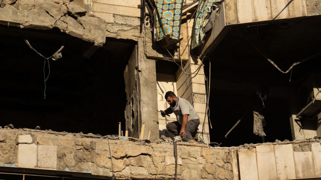 BEIRUT, LEBANON - OCTOBER 3: A man works at the site of an Israeli airstrike on an apartment block, on October 3, 2024 in Beirut, Lebanon. Israel continued airstrikes on Beirut and its southern suburbs as its military announced a ground offensive in Lebanon, part of what it said would be a "limited" incursion to target Hezbollah forces. (Photo by Carl Court/Getty Images)