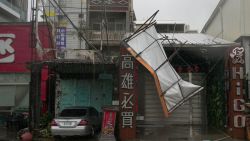 A wrecked store sign is seen after Typhoon Krathon made landfall in Kaohsiung on October 3, 2024. Typhoon Krathon made landfall in Taiwan's south on October 3, the island's weather agency said, after forcing schools and offices to shut for a second day amid winds and rain that have left two dead and more than 100 injured. (Photo by WALID BERRAZEG / AFP) (Photo by WALID BERRAZEG/AFP via Getty Images)