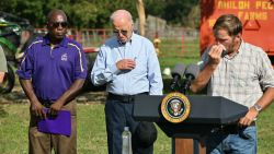 US President Joe Biden (C) crosses himself after prayer alongside Buck Paulk (R), property manager of Shiloh Pecan Farm, in Ray City, Georgia, on October 3, 2024, after Biden toured areas impacted by Hurricane Helene. (Photo by Mandel NGAN / AFP) (Photo by MANDEL NGAN/AFP via Getty Images)