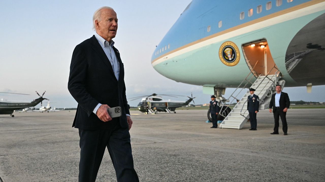 US President Joe Biden walks to speak to reporters after stepping off Air Force One upon arrival at Joint Base Andrews in Maryland on October 3.