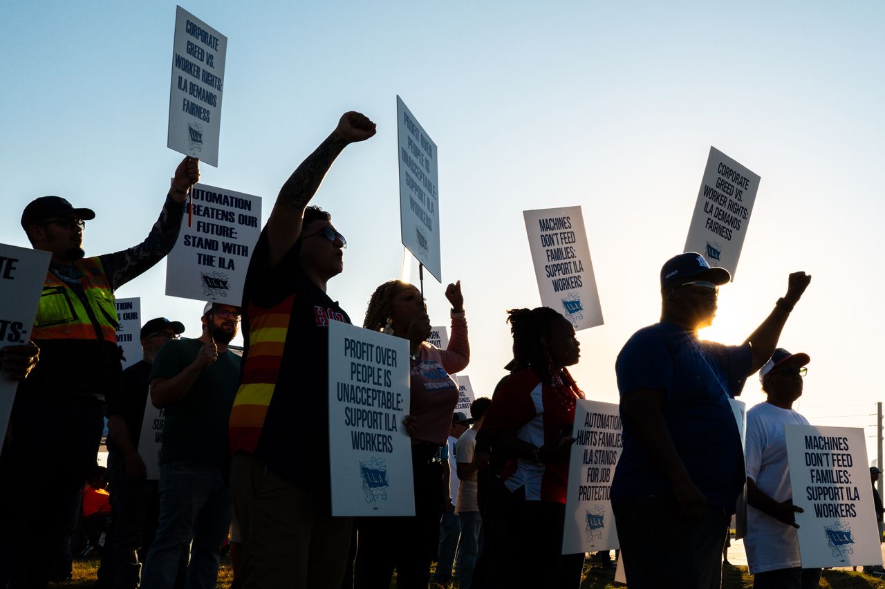 Dockworkers strike in a picket line outside of the Port of Houston Authority today in Houston, Texas. Members of the International Longshoreman's Association have begun a nationwide strike, consisting of more than 50,000 workers at ports along the East Coast and Texas. The strike, affecting 36 ports, marks a historic event and is the first by the union since 1977. The strike comes after negotiations between the International Longshoreman's Association and the United States Maritime Alliance failed to reach an agreement on better wages and automation.