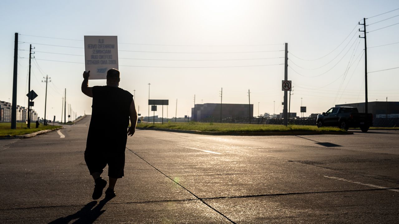 A dockworker strikes outside of the Port of Houston Authority today in Houston, Texas.