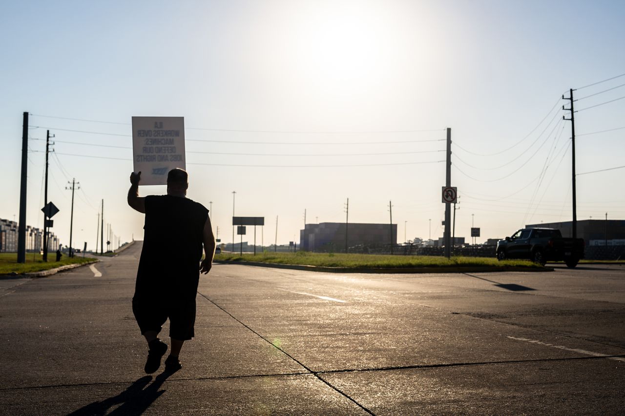 A dockworker strikes outside of the Port of Houston Authority today in Houston, Texas.