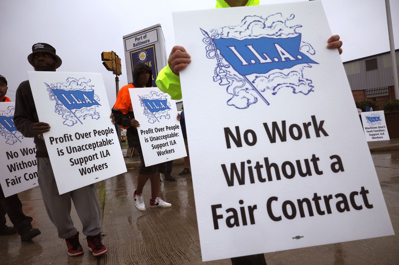 Longshoremen with the International Longshoremen’s Association (ILA) and their supporters picket outside of the Dundalk Marine Terminal at the Port of Baltimore on October 1 in Baltimore, Maryland.