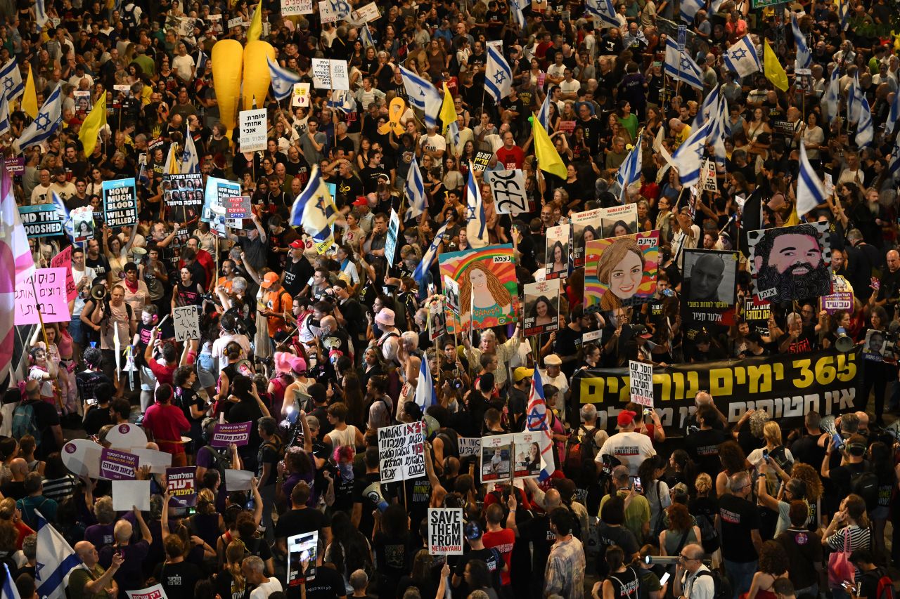 A crowd of protesters marches through Tel Aviv, Israel, on Saturday.