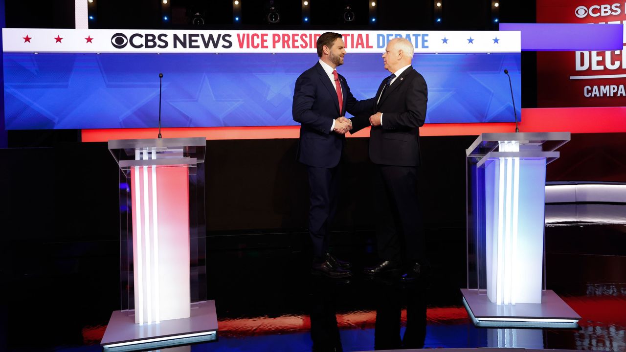 Ohio Sen. JD Vance and Minnesota Gov. Tim Walz greet each other ahead of a debate at the CBS Broadcast Center on October 1, 2024 in New York City.