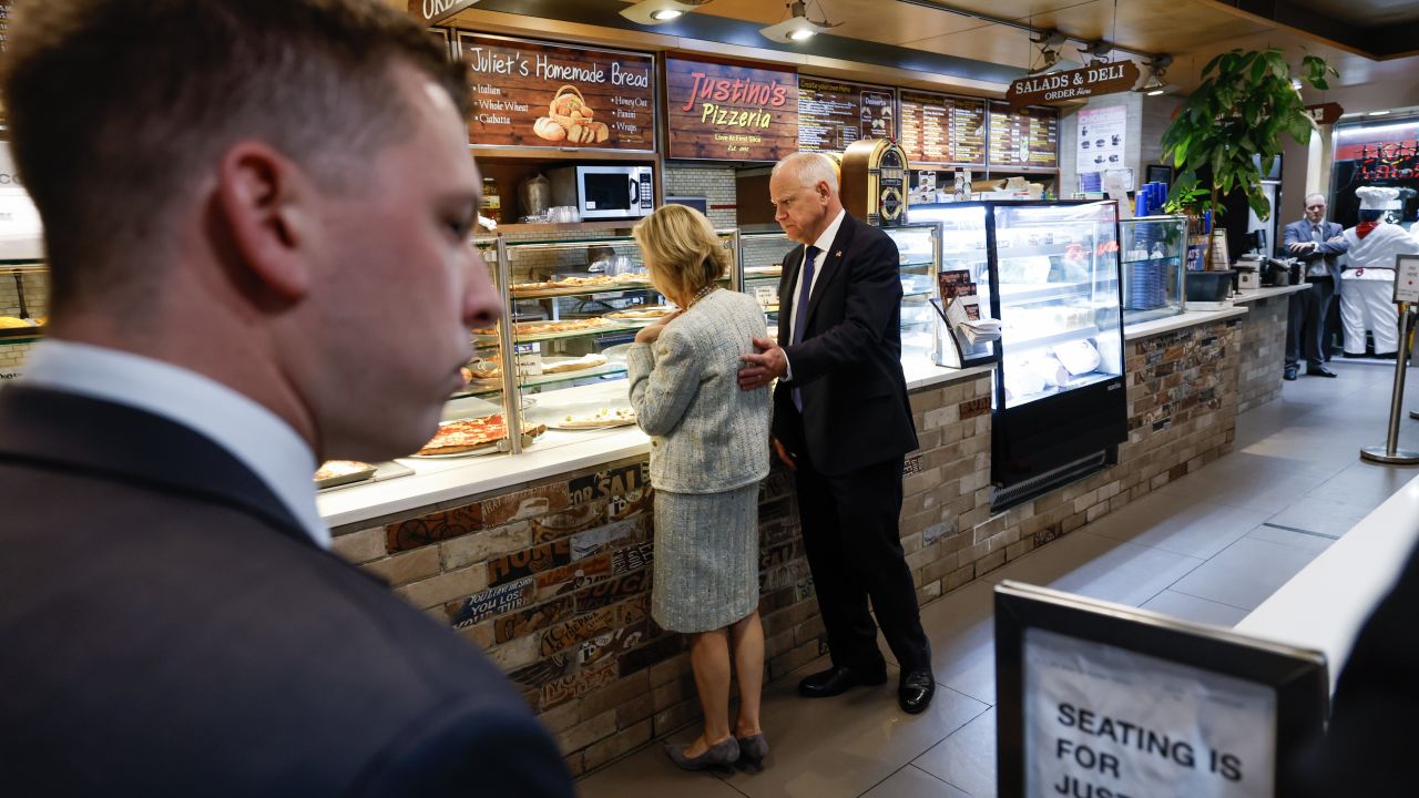 Minnesota Gov. Tim Walz and his wife Gwen Walz visit Justino's Pizzeria after his debate with Republican vice presidential candidate Sen. JD Vance on Tuesday in New York.