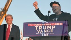 TOPSHOT - Tesla CEO Elon Musk (R) speaks on stage as he joins former US President and Republican presidential candidate Donald Trump during a campaign rally at site of his first assassination attempt in Butler, Pennsylvania on October 5, 2024. (Photo by Jim WATSON / AFP) (Photo by JIM WATSON/AFP via Getty Images)