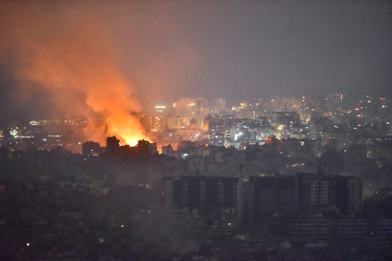 Flames and smoke rise in an area targeted by an Israeli air strike on Beirut's southern suburbs, on October 6.