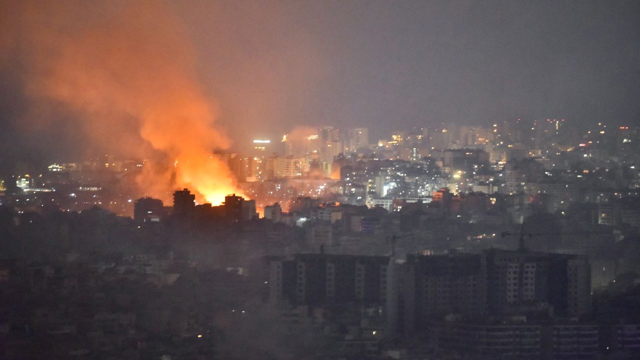 Flames and smoke rise in an area targeted by an Israeli air strike on Beirut's southern suburbs, October 6, 2024. Official Lebanese media said five Israeli strikes hit south Beirut and its outskirts during the night of Octobre 5, 2024, four of them "very violent", after the Israeli army called residents to evacuate the Hezbollah bastion. (Photo by Fadel ITANI / AFP) (Photo by FADEL ITANI/AFP via Getty Images)