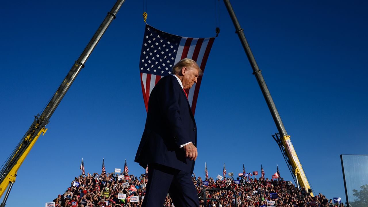 Former US President Donald Trump walks onstage during a campaign event at the Butler Farm Show in Butler, Pennsylvania, US, on Saturday.