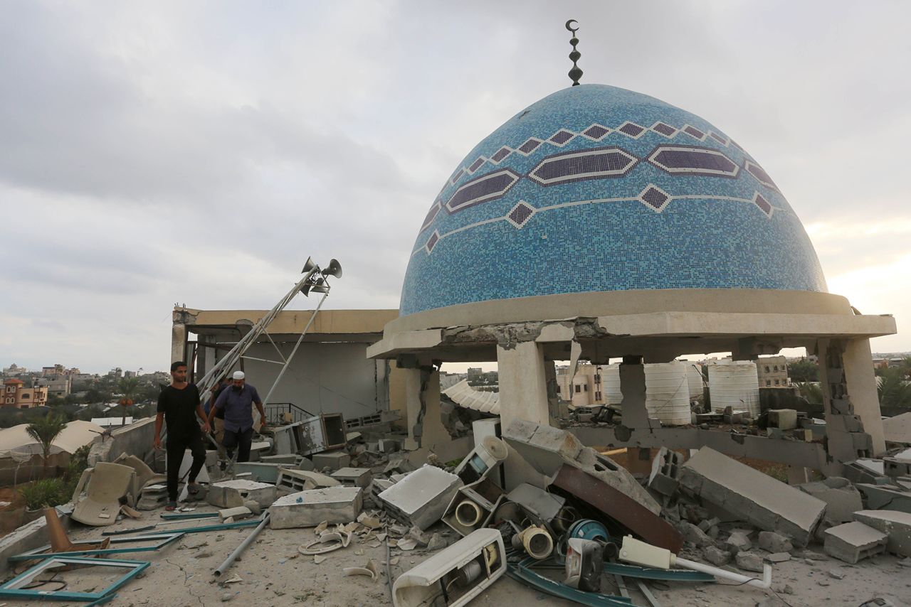 Palestinians inspect the rubble of mosque, which was damaged in Israeli attack in Deir al-Balah, Gaza on October 6.