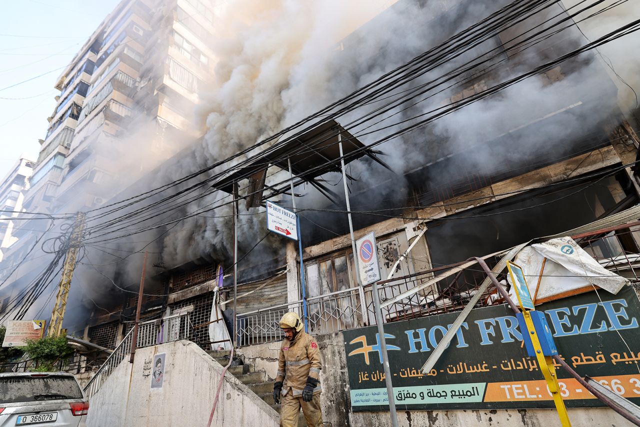 Heavy smoke rises from a building that was set ablaze.