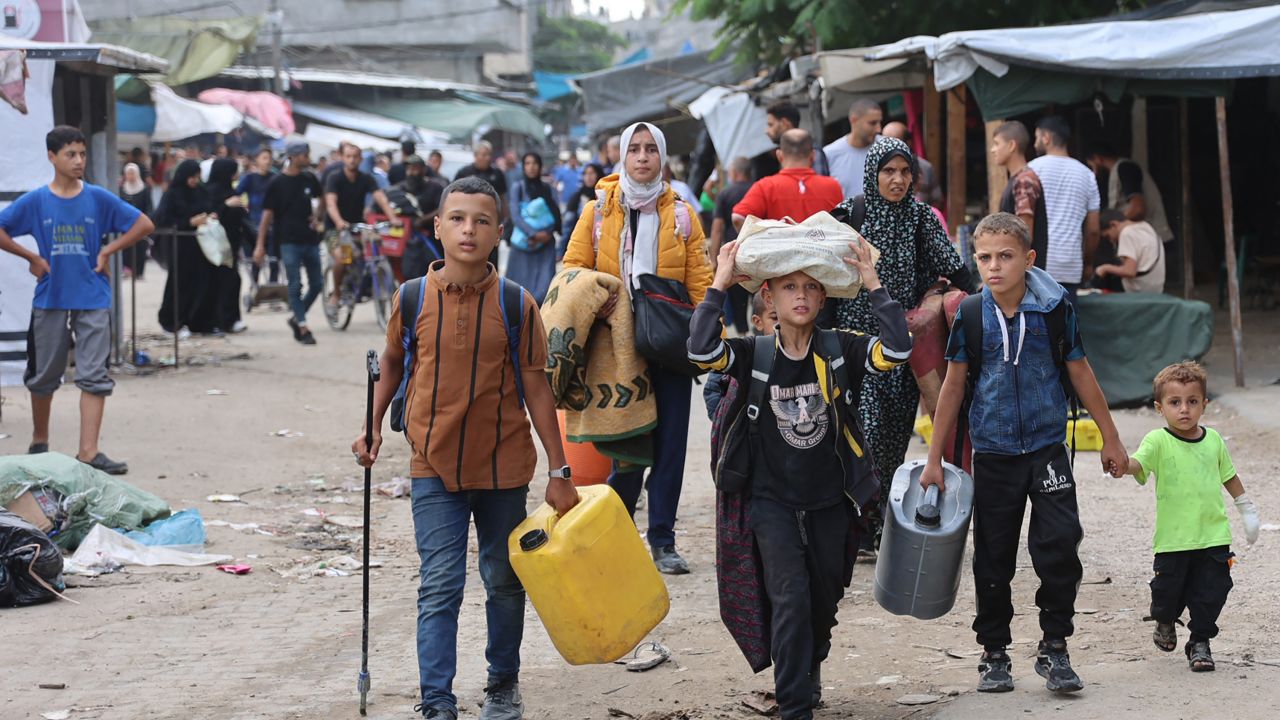 Palestinian families arrive in Gaza City after evacuating their homes in the Jabalia area on October 6, after the Israeli army ordered people to evacuate the area north of Gaza. 