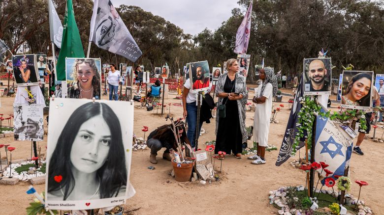 People visit a memorial for the victims killed at or kidnapped from the Supernova music festival during the October 7 attacks by Palestinian militants, at the festival site near Kibbutz Reim in southern Israel, on the eve of the attacks' first anniversary on October 6, 2024. (Photo by Menahem KAHANA / AFP) (Photo by MENAHEM KAHANA/AFP via Getty Images)          