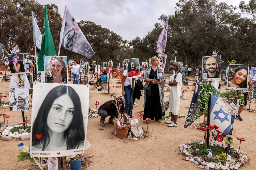People visit a memorial to the victims killed at or kidnapped from the Nova Music Festival during the October 7, 2023 attacks.