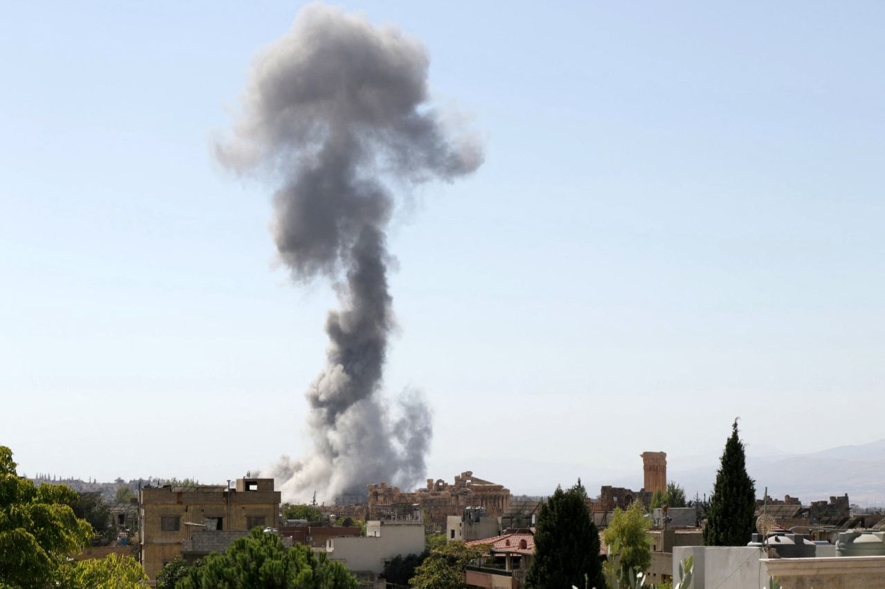 Smoke billows following an Israeli airstrike near the ruins of the ancient Roman Temple of Bacchus in Lebanon's eastern city of Baalbek in the Bekaa valley on October 6, 2024. (Photo by Nidal SOLH / AFP) (Photo by NIDAL SOLH/AFP via Getty Images)