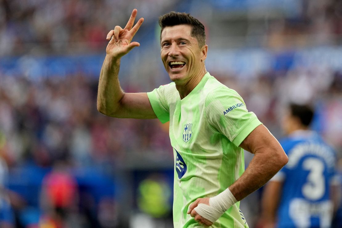 Barcelona's Polish forward Robert Lewandowski celebrates after completing his hat-trick.