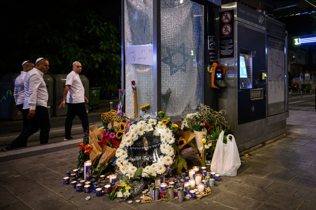 Floral tributes and candles for those killed in a gun and knife attack on October 2, 2024 in Tel Aviv, Israel.