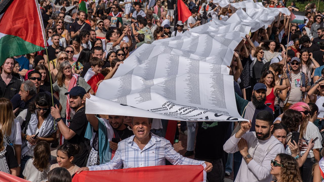 A long roll of paper containing the names of people killed in the Israeli occupation is seen carried by protesters in Plaza de Catalunya during the rally in Barcelona, Spain, on October 6.