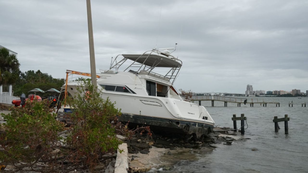 A beached boat as a result of Hurricane Helene is seen in Clearwater, Florida ahead of Hurricane Milton's expected mid-week landfall, on October 6, 2024. Another potentially devastating storm barreled toward the Florida coast on October 6, as the head of the US disaster relief agency lashed out at a "dangerous" misinformation war being waged over the aftermath of Hurricane Helene.
The National Hurricane Center (NHC) said the new storm, Milton, had intensified into a Category 1 hurricane Sunday with maximum sustained winds of 80 miles (130 kilometers) an hour. (Photo by Bryan R. SMITH / AFP) (Photo by BRYAN R. SMITH/AFP via Getty Images)